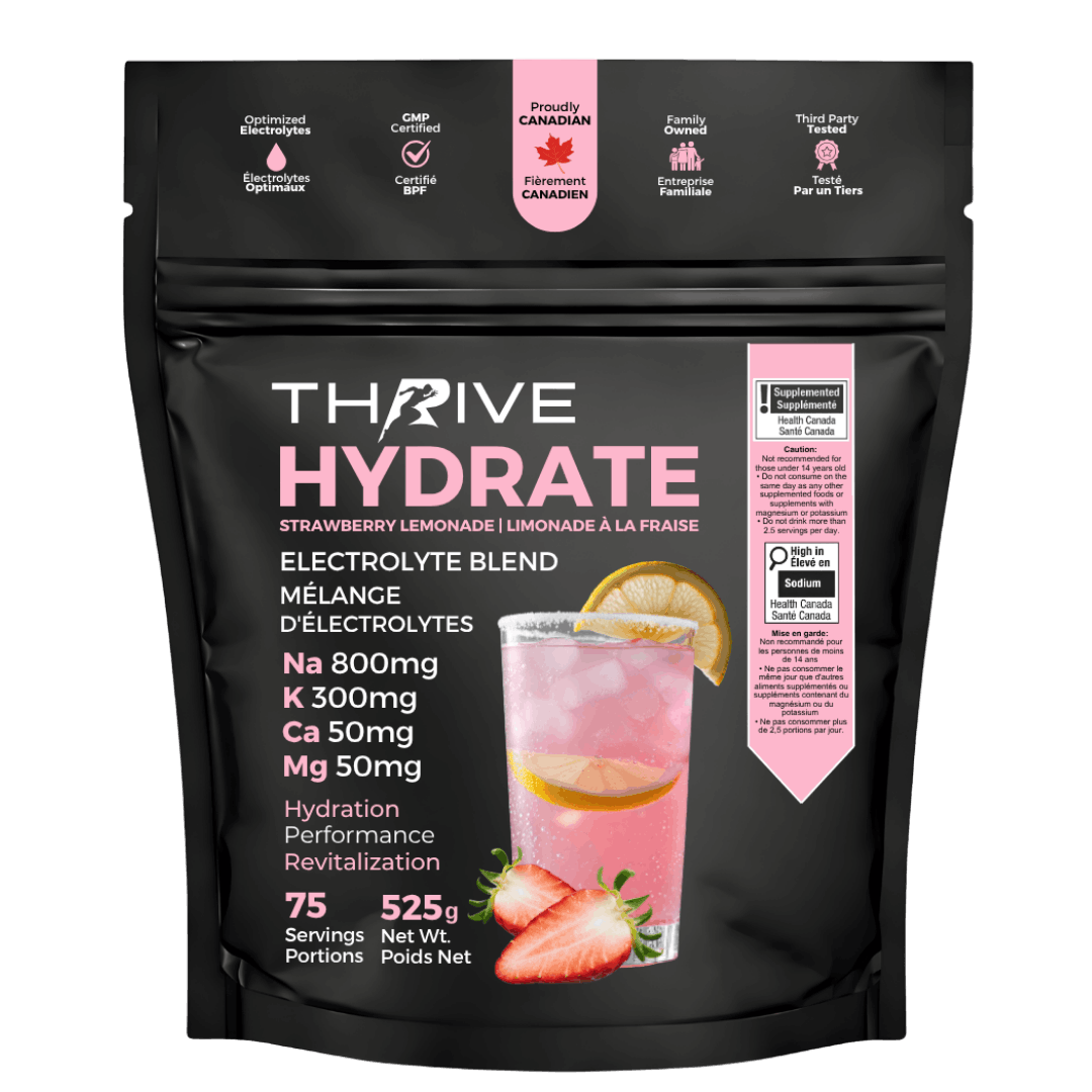 Black stand-up pouch of Thrive Hydrate Strawberry Lemonade Electrolyte Blend with pink branding, featuring a glass of pink lemonade with lemon and strawberry slices, electrolyte highlights, and Health Canada supplemented food warning labels.